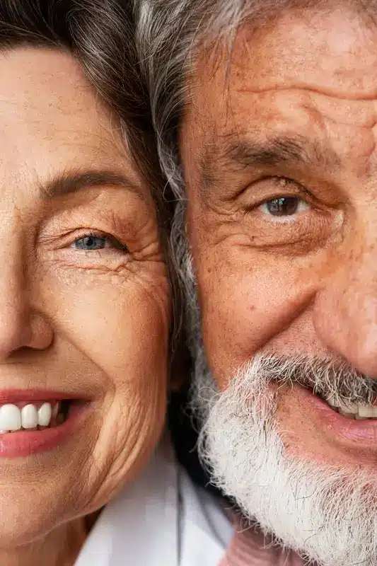 front-view-smiley-senior-couple